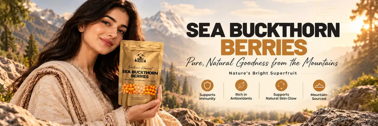 Pakistani woman holding The North Bliss Sea Buckthorn Berries pouch in a mountain setting, highlighting immunity, antioxidants and natural skin glow